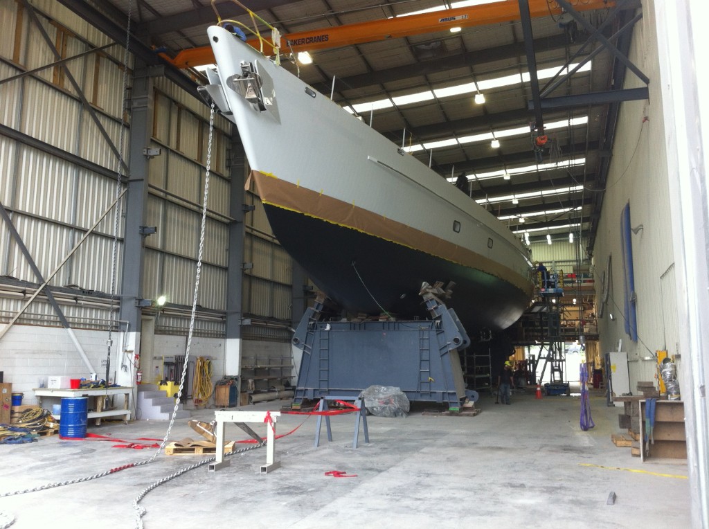Superyacht under construction inside a workshop